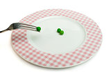 Plate with peas and centimeter measure