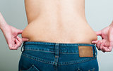 Woman pinching fat from her waist