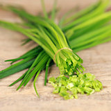 Chopped chives on a kitchen board