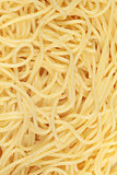 Cooked spaghetti forming a background