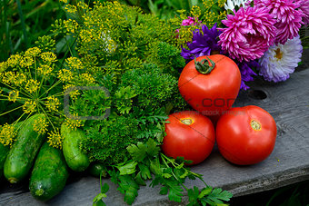 Fresh vegetables and flowers still life