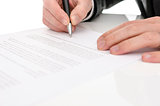 Closeup of a man signing a contract