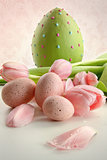 Easter eggs and pink tulips with vintage feeling
