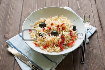 Rice with red capsicum and black olives