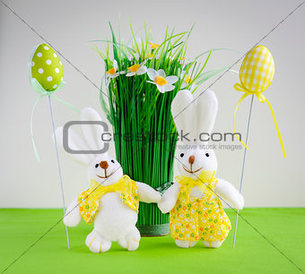 Easter funny bunnies with eggs and flowers