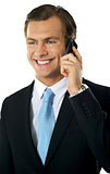 Businessman communicating via cellphone