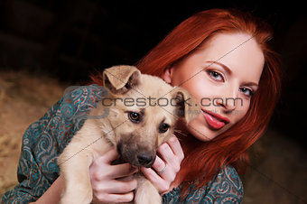 young woman playing with her dog