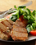 beef steak grilled with fresh salad garnish