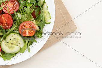 salad from ruccola, cherry tomatoes and cucumber