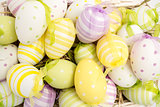 Colourful easter eggs in straw