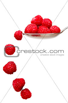 Raspberries on a spoon isolated on a white background