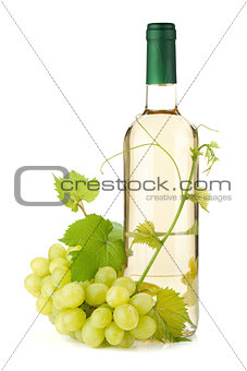 White wine bottle and grapes