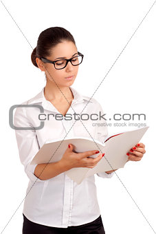 Smiling business woman holding magazine