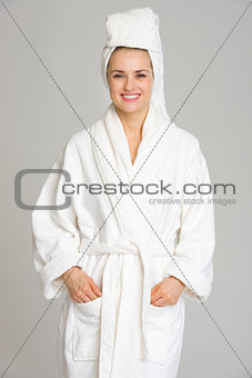Portrait of happy young woman in bathrobe