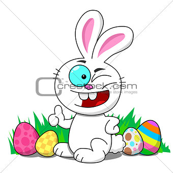 Easter bunny sitting in a patch winking with Easter eggs