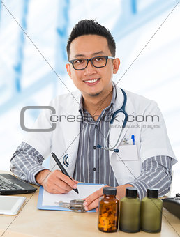 Asian medical doctor working on his desk