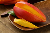 fresh fruit mango on wooden plate
