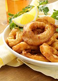 fried squid rings dipped in batter with lemon