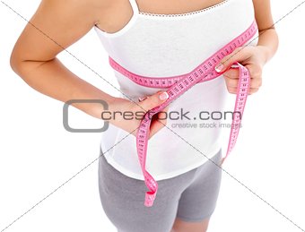 Woman measuring breast