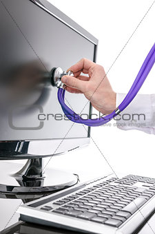 Serviceman testing a computer with stethoscope