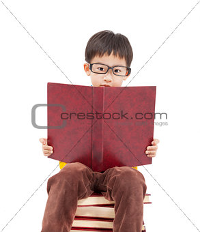 little boy studying on the books
