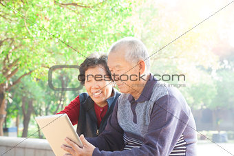 happy asian  Senior couple with tablet pc