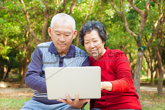 happy asian  Senior couple with laptop