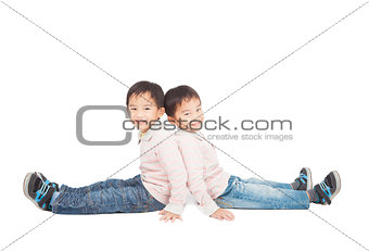 two little boy sitting on the floor