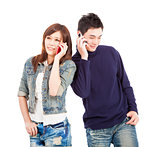 happy asian couple talking on the phone 