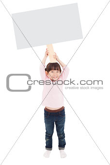 happy little girl showing the blank billboard