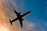 Airliner silhouette against the blue sky