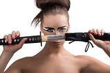 brunette in japan style with katana in front of the face