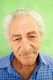 Portrait of happy elderly caucasian man smiling at camera