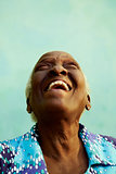 Portrait of funny elderly black woman smiling and laughing