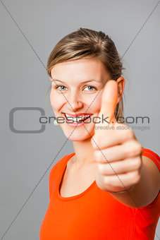 young woman thumb up