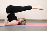 young woman doing yoga exercises