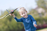 child playing with a plane