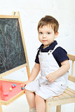 Child Drawing With Chalk