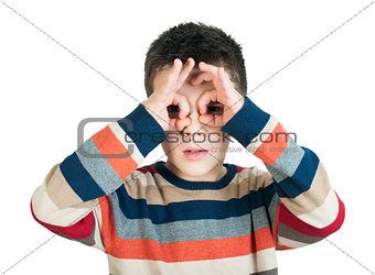 Child looking through his ââhands