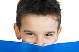Child with notebook in front of the face