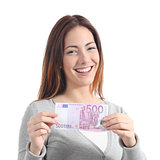 Happy woman showing a five hundred euros banknote