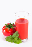 The glass of tomato juice with parsley
