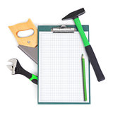 Clipboard and green tools