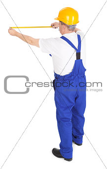 worker with tape measure 