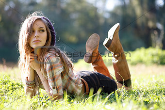 Beautiful Young Woman lying on grass