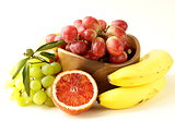 red and green grapes, bananas and oranges - tropical fruit