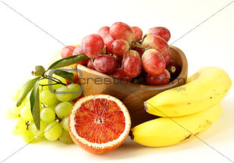 red and green grapes, bananas and oranges - tropical fruit