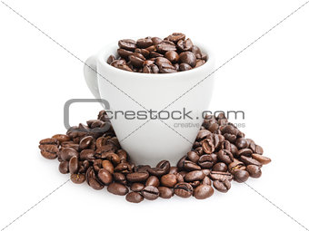heap of coffee beans in cup