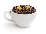 heap of coffee beans in cup with cane-sugar