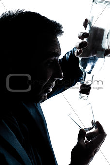 silhouette man drunk pouring empty alcohol botlle